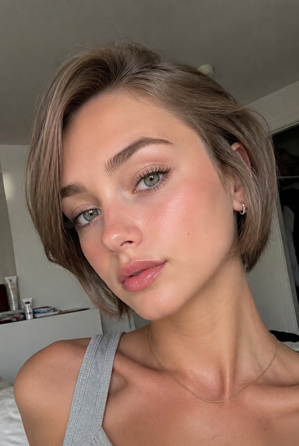A woman in natural daylight showing healthy glowing skin