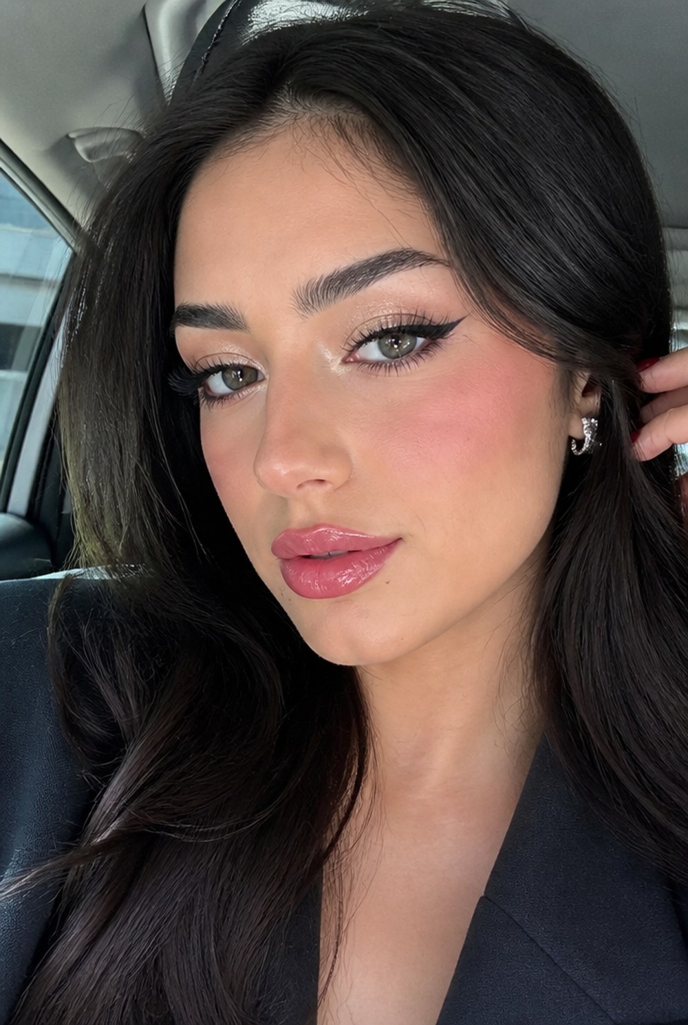 A woman wearing a bold lip color