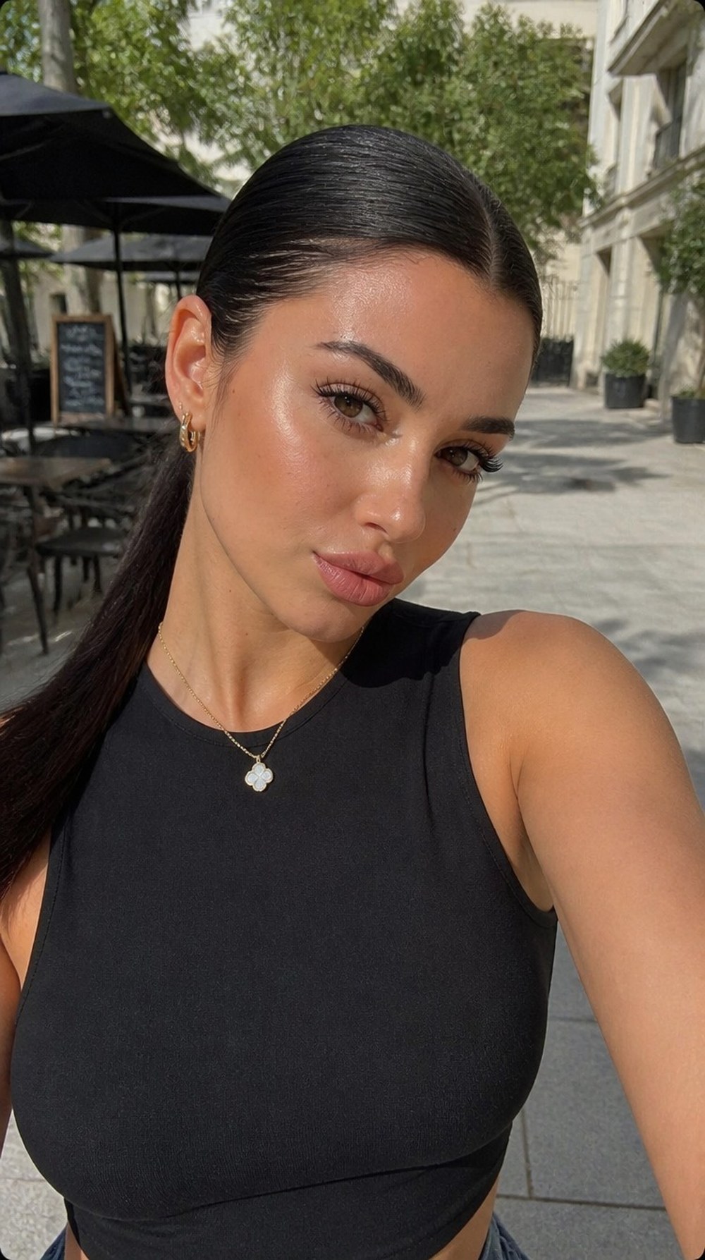 A woman with a sleek, face-flattering haircut