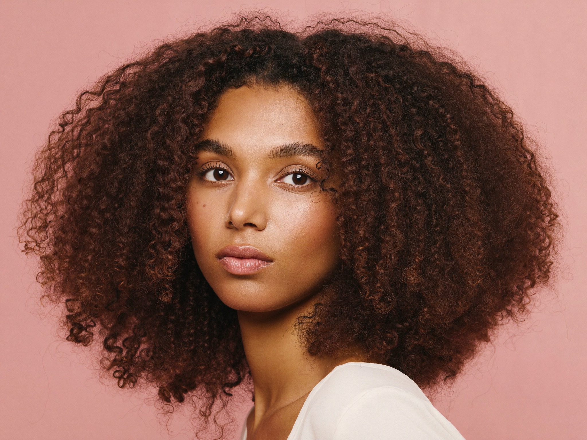 Shoulder-length Curls for oval face shape
